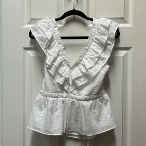White express top. Open back with tying bow.